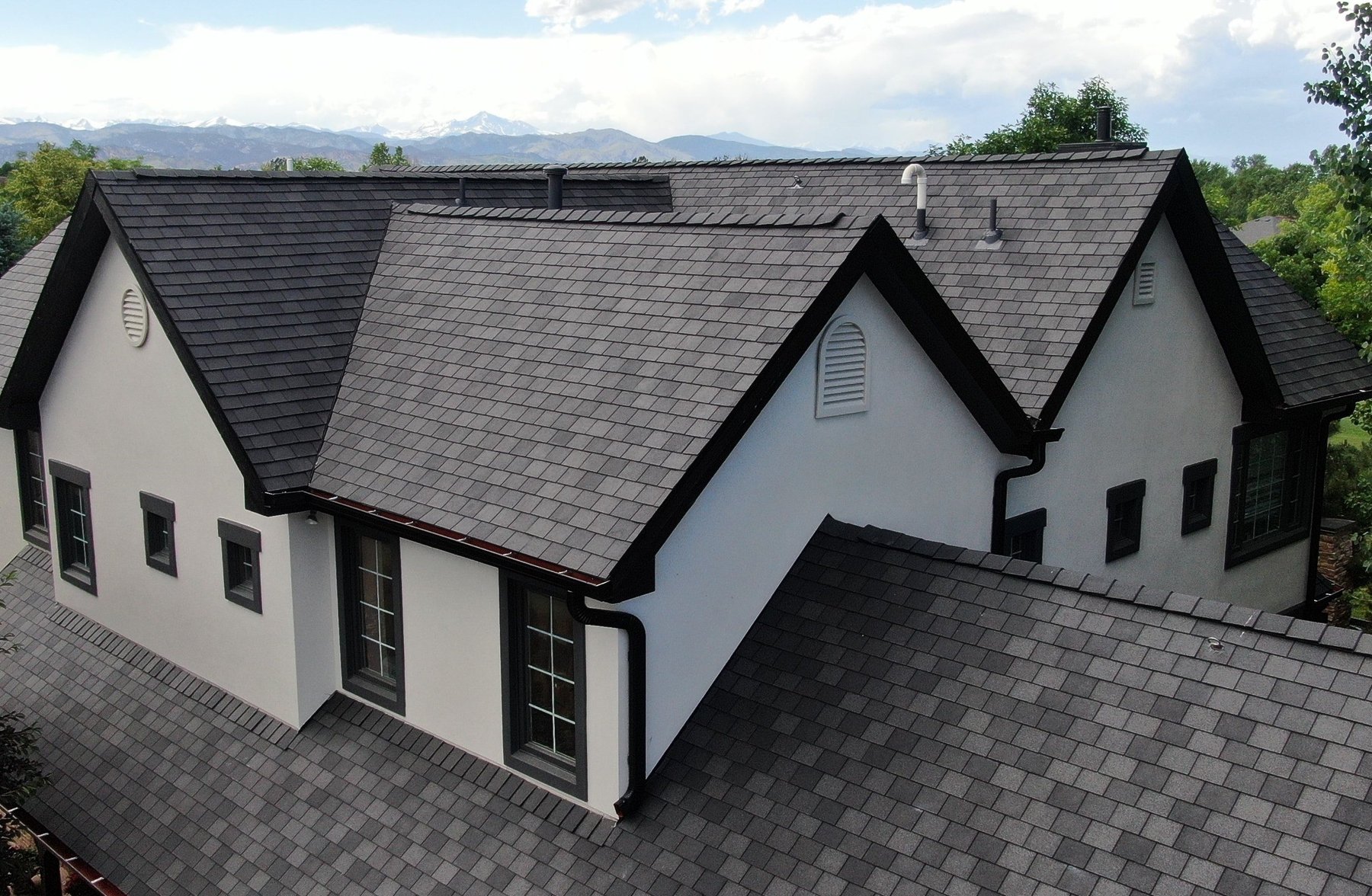 Designer slate-look premium shingles on a stucco home Knoxville