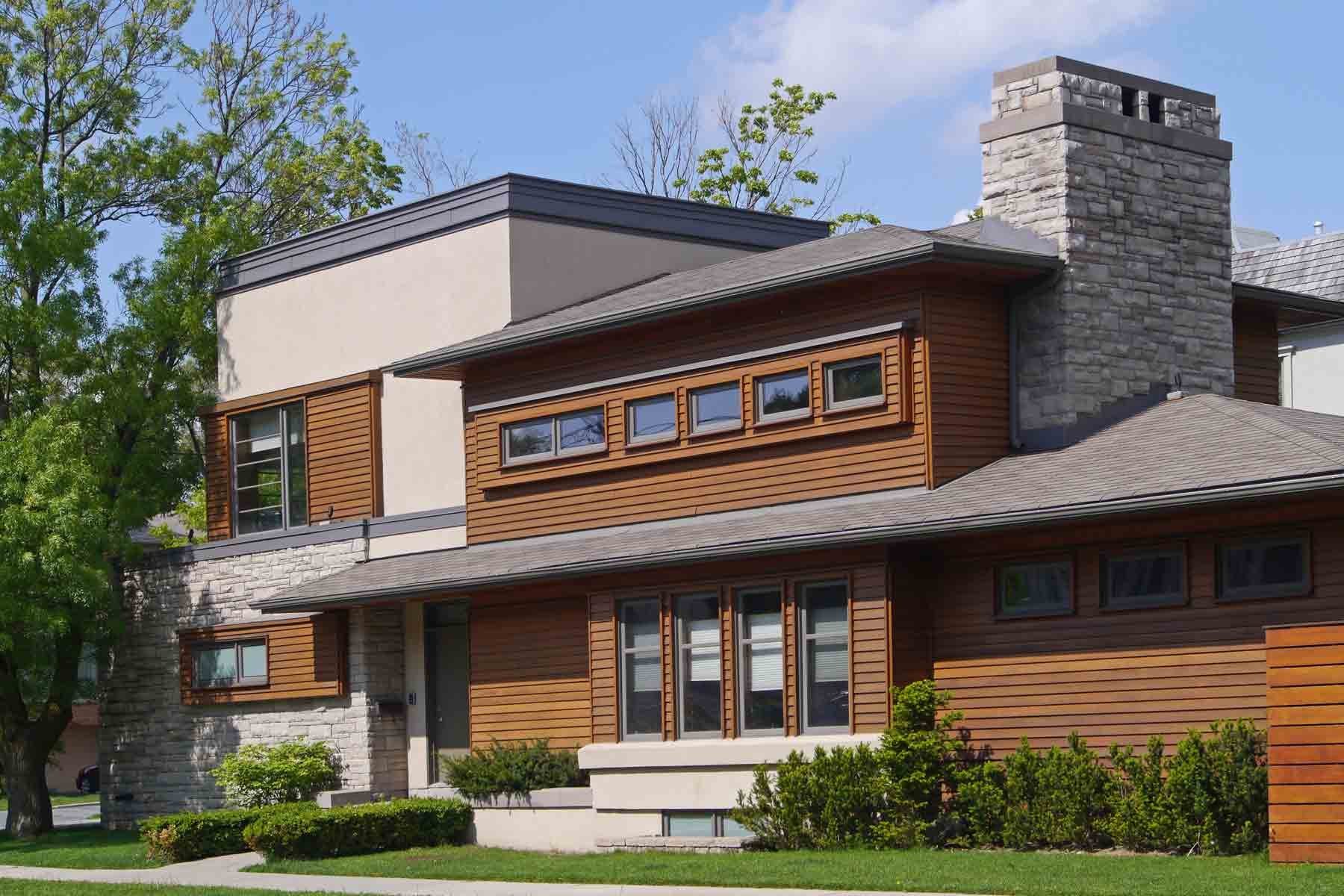 Modern home with cedar siding and stone accents