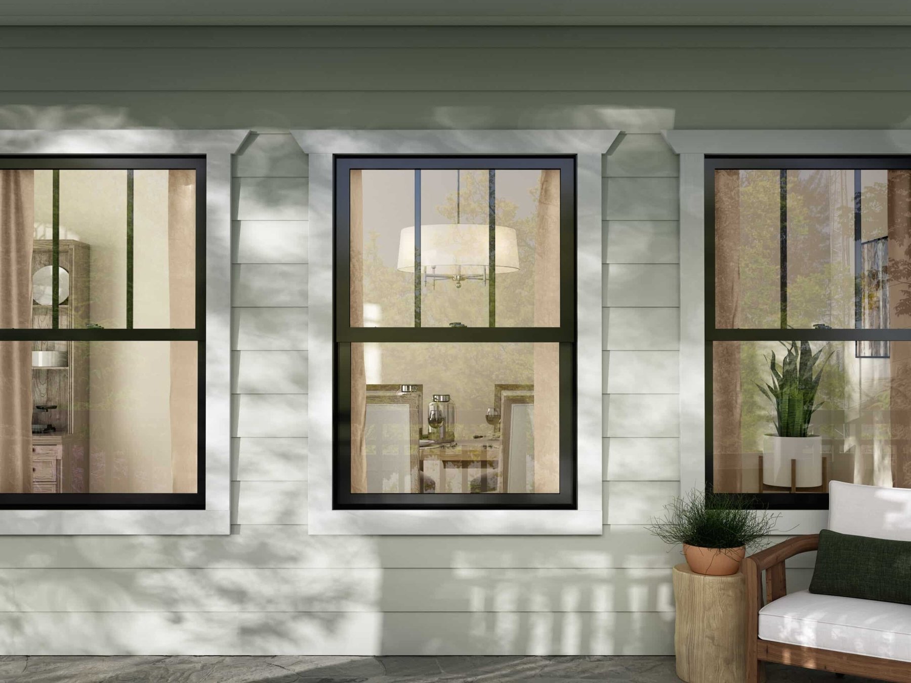 Single-hung windows on green lap siding Knoxville